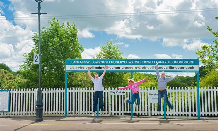 Young people jumping at Llanfair pg